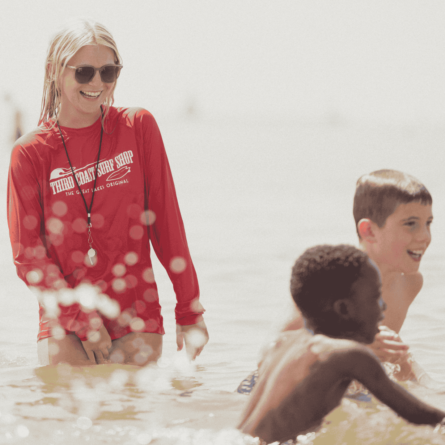 kids playing in the water during the summer camp session