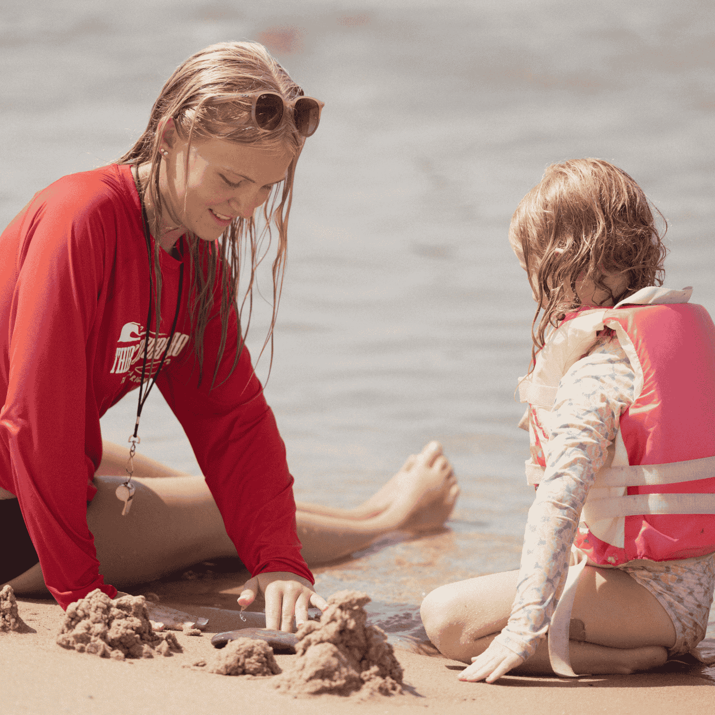 kids playing on the beach during summer camp session