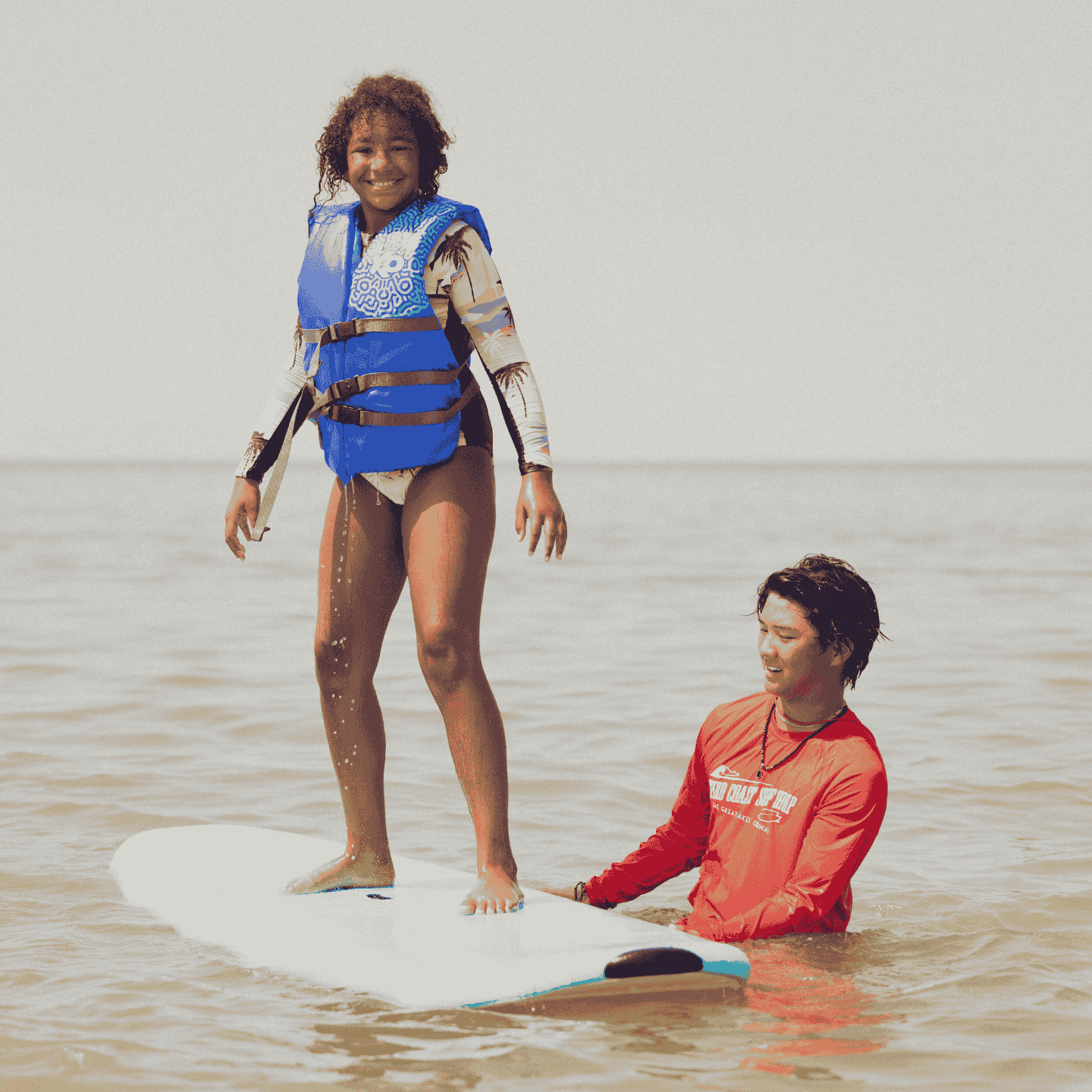 kids learning how to surf